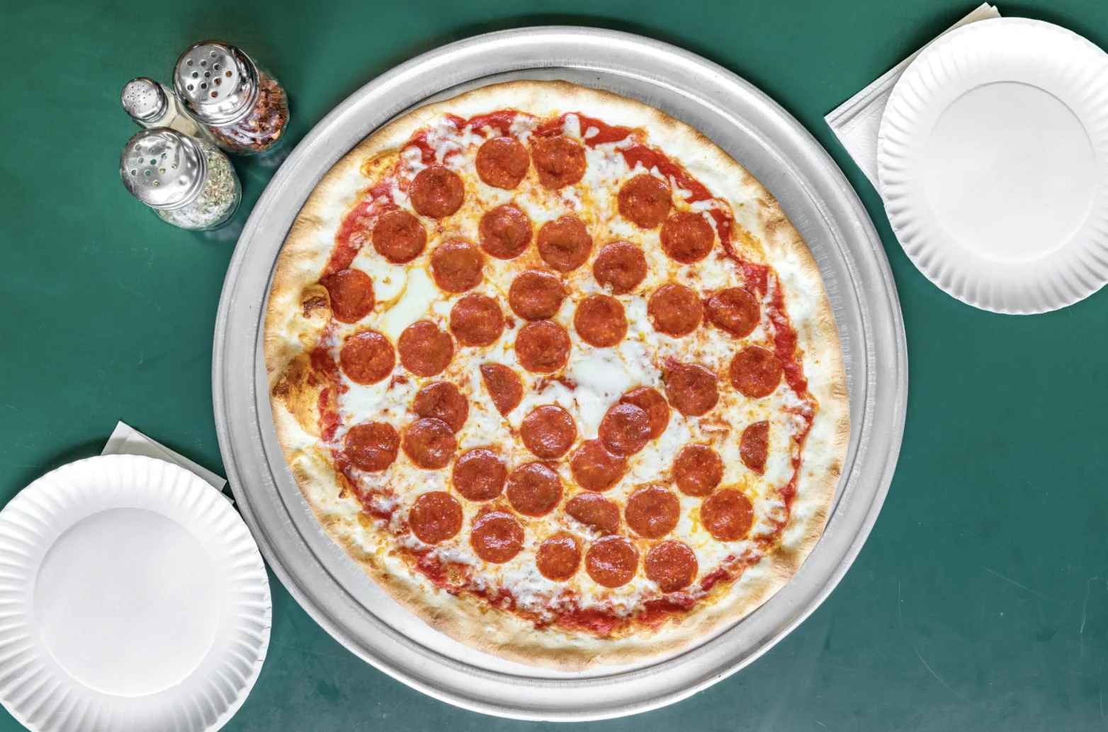 Pepperoni pizza on a metal tray